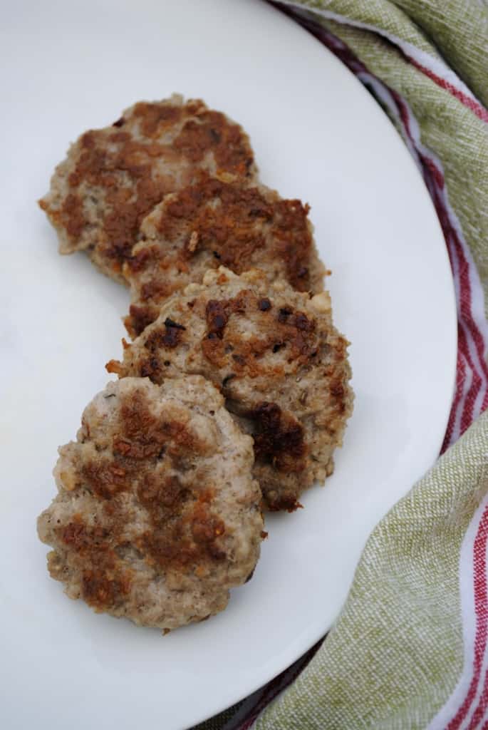 Homemade breakfast sausage patties on a white plate