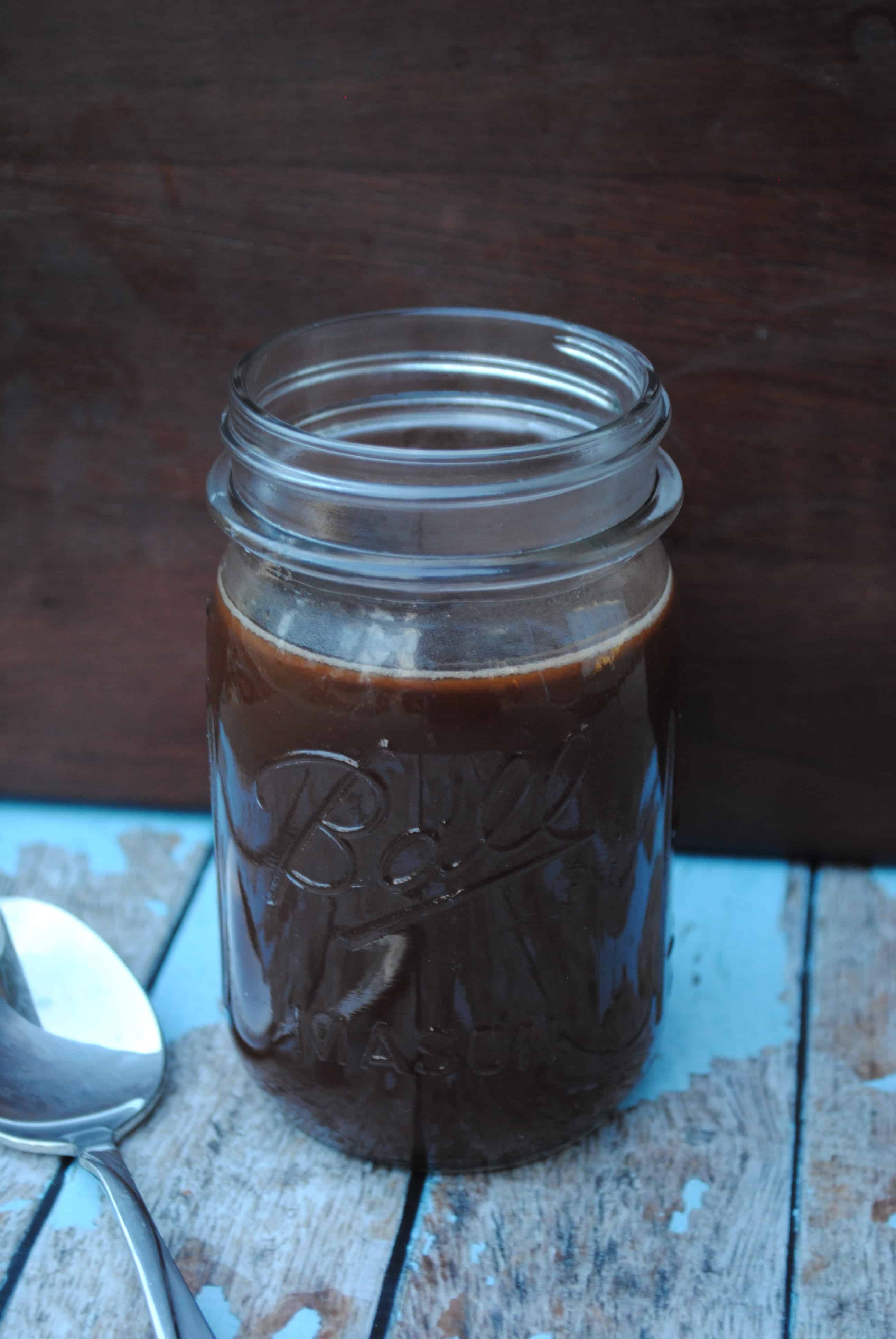 Homemade chocolate syrup in a jar