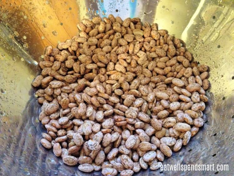 rinsed pinto beans in a metal colander