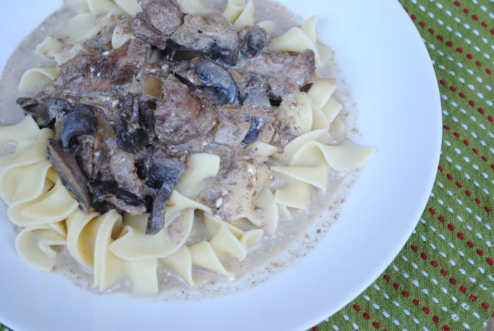 slow cooker beef stroganoff on a white plate