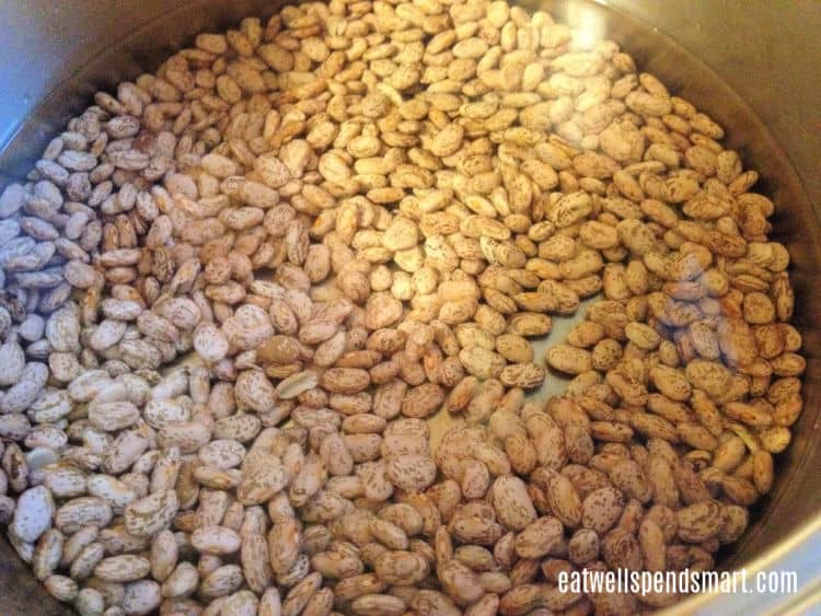 pinto beans soaking in a pot of water