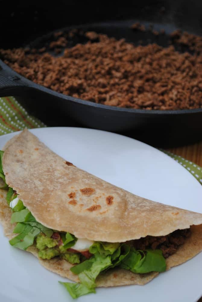 Homemade whole wheat tortillas made into a taco