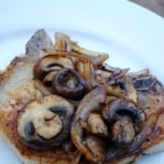 Pork chops smothered with onions and mushrooms. Simple meal, big on flavor.