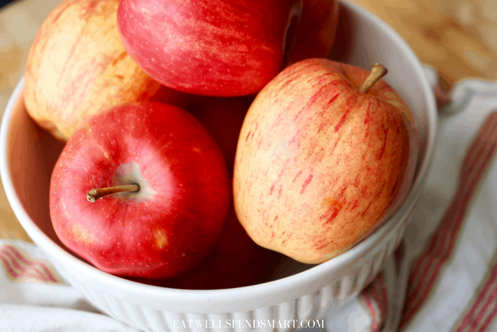 Red apples in a white bowl