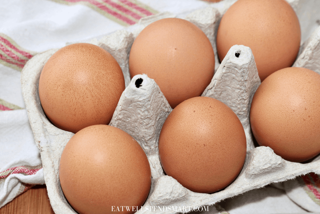 brown eggs in a cardboard carton