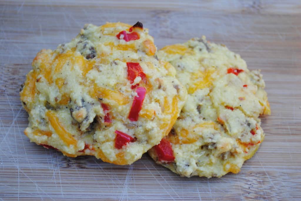 two savory breakfast muffins on a cutting board
