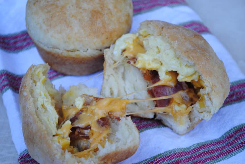 stuffed biscuit muffin broken in half to reveal the inside filling