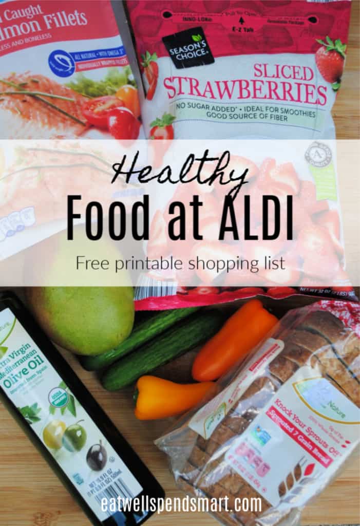 healthy food at aldi graphic on top of produce, olive oil, bread, frozen salmon, and frozen strawberries