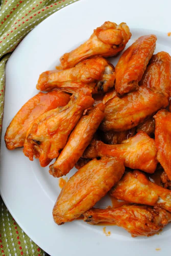 baked buffalo wings on a white plate