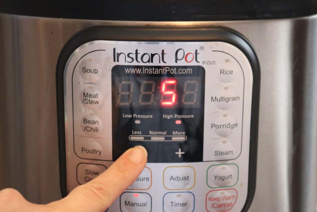 finger setting the Instant Pot