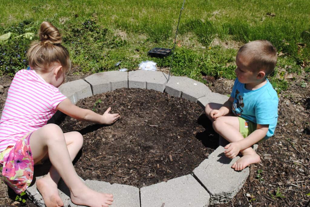 Children planting a garden