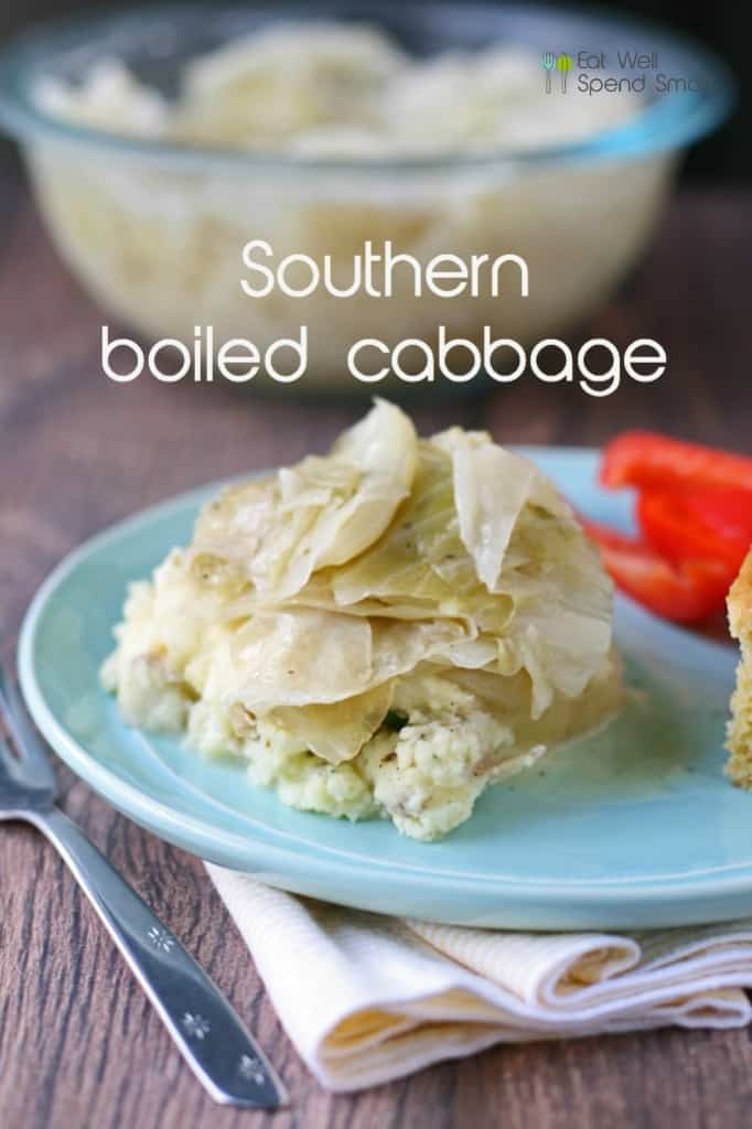 boiled cabbage on top of mashed potatoes and a light blue plate