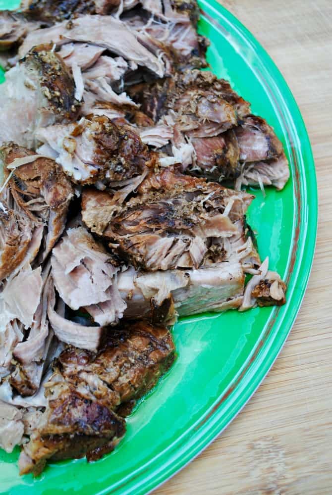 slow cooker pork roast on a green plate