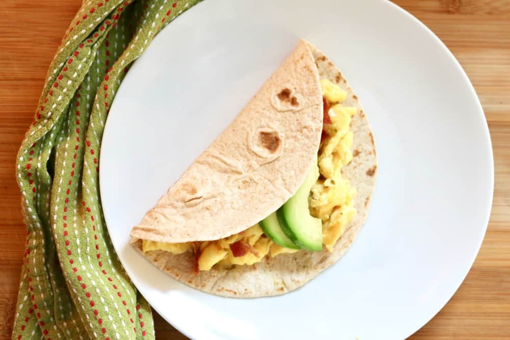 breakfast taco on a white plate