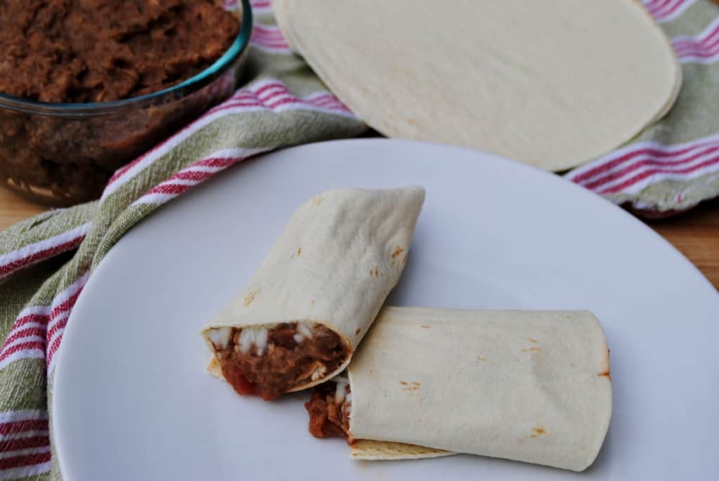 Bean burrito on a plate.