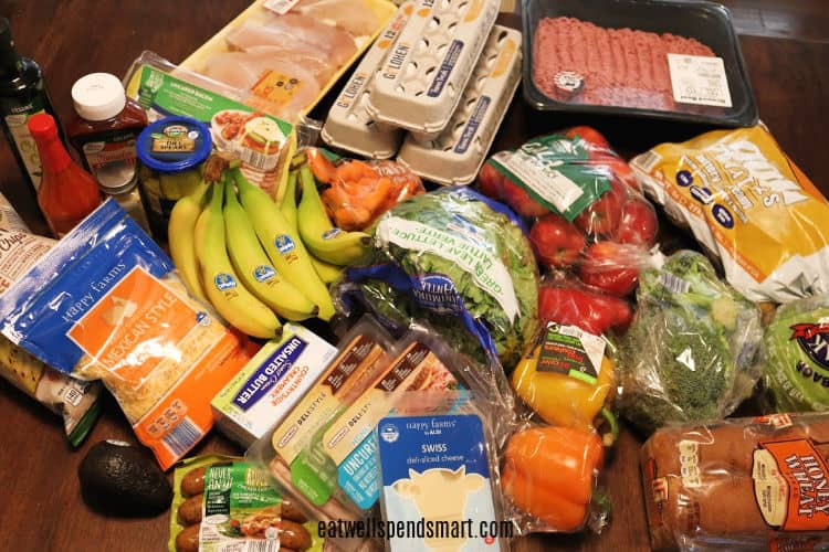 grocery haul spread on a wooden table