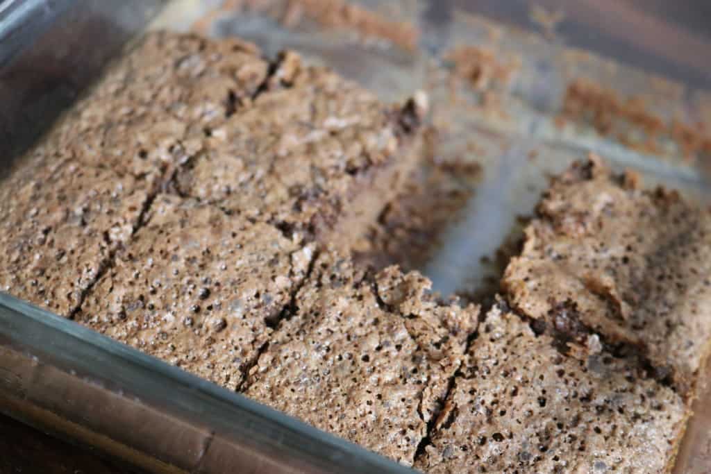 glass pan with half eaten brownies