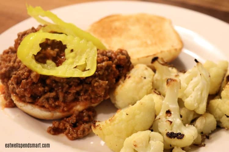 Sloppy Joe topped with banana peppers with roasted cauliflower on the side