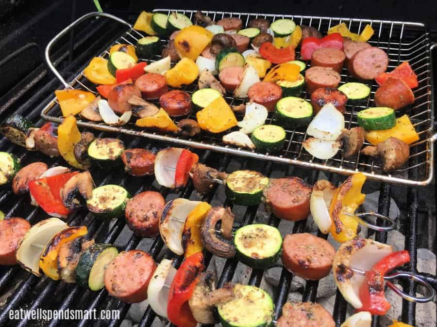 Smoked sausage and vegetable kabobs on the grill.