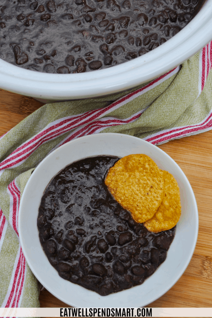 black bean soup in a cup with tortilla chips