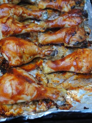bbq chicken legs on a baking sheet