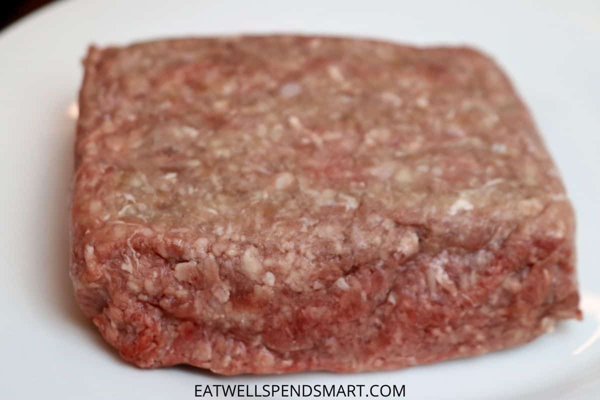 raw ground beef on a white plate