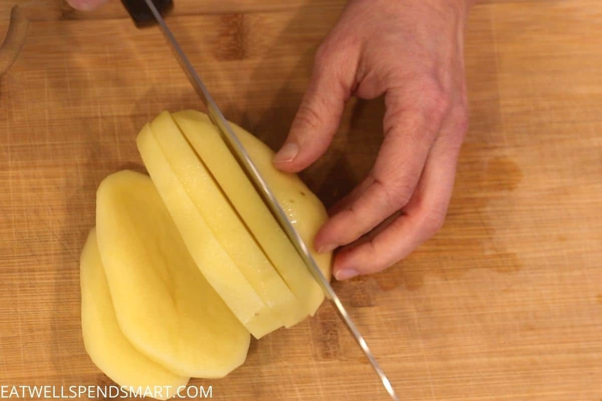 knife slicing potato into six slices