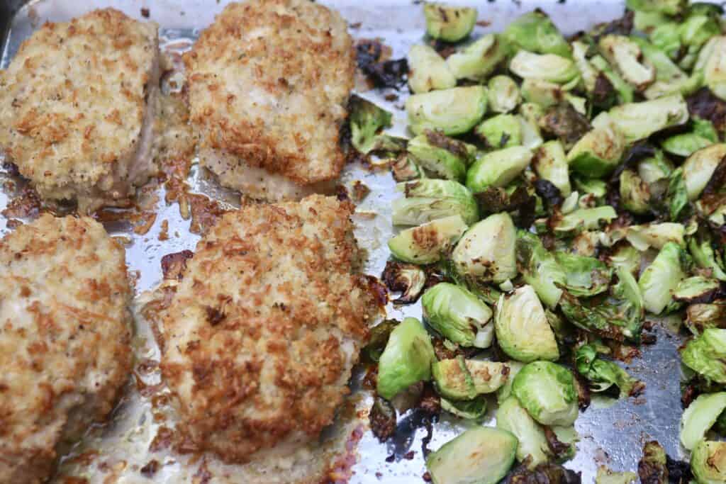 Sheet pan dinner of parmesan pork chops and Brussels sprouts