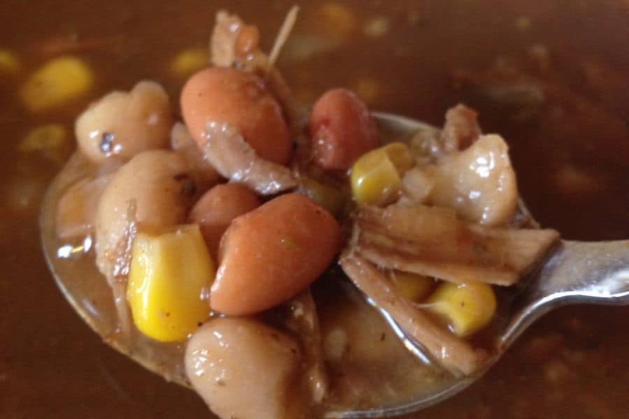 Mexican pork and bean soup in a spoon