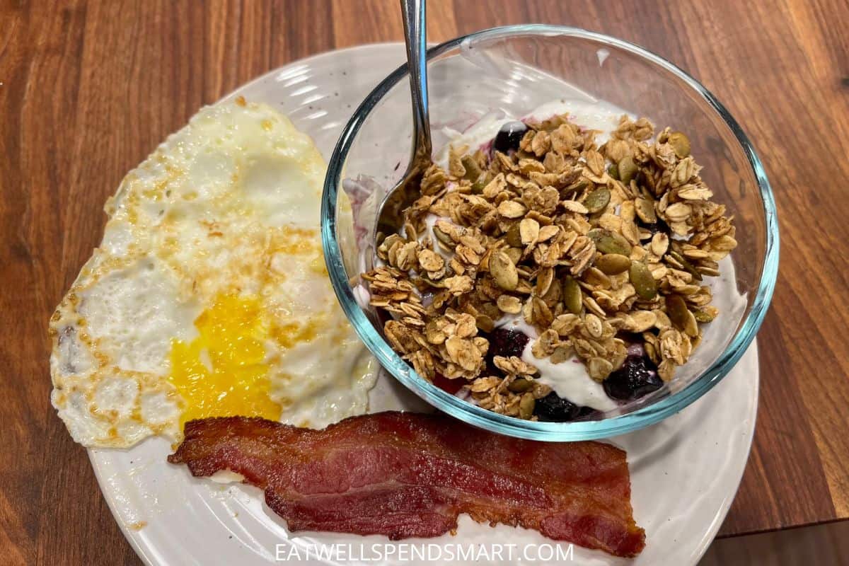 egg, bacon, and yogurt with fruit and granola