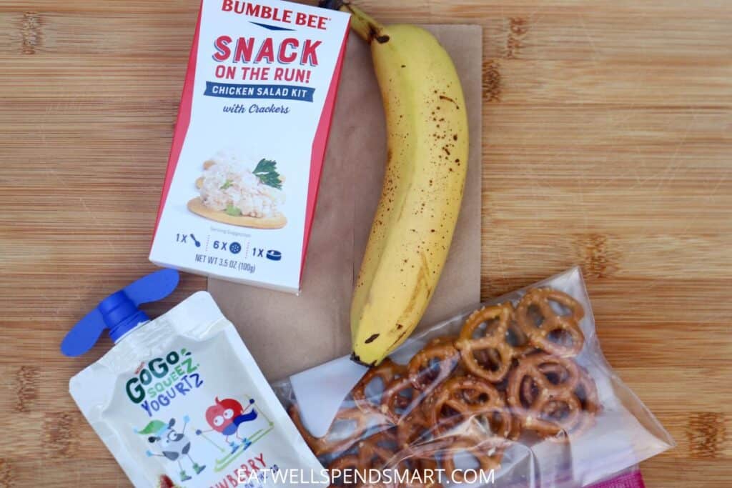 chicken salad kit, banana, pretzels, yogurt pouch