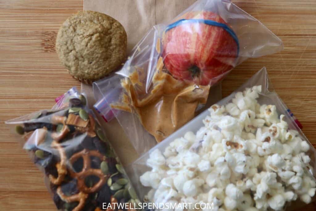 muffin, apple with peanut butter, popcorn, trail mix