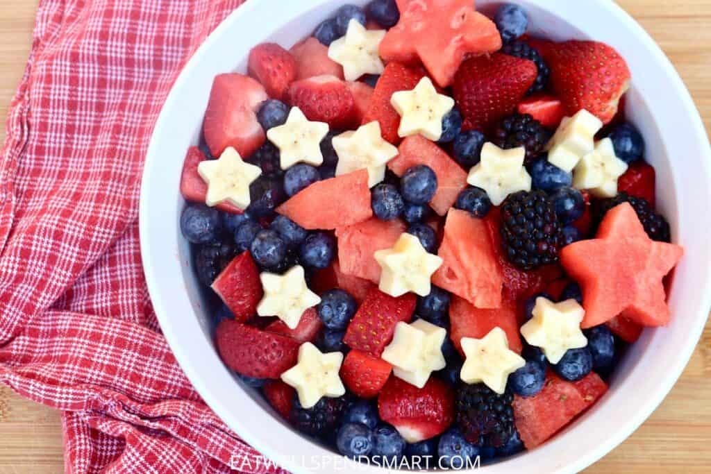 Fruit salad with strawberries, watermelon, blueberries, blackberries, and star shaped bananas