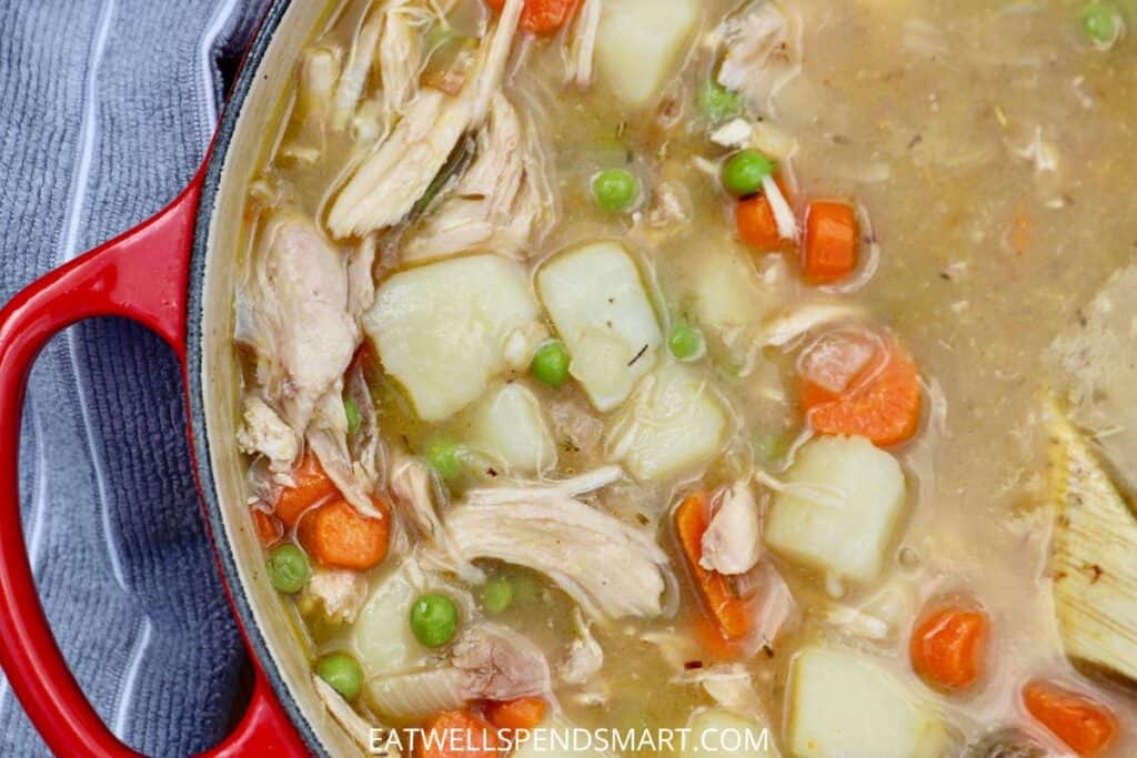 chicken stew in a red pot