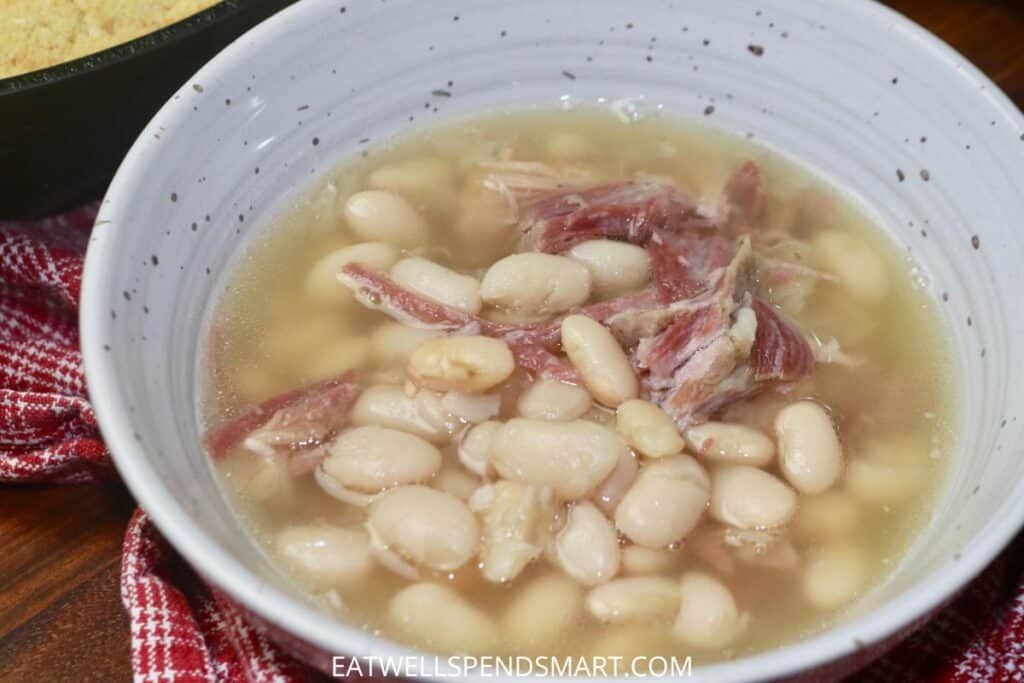 A bowl of great northern beans and ham