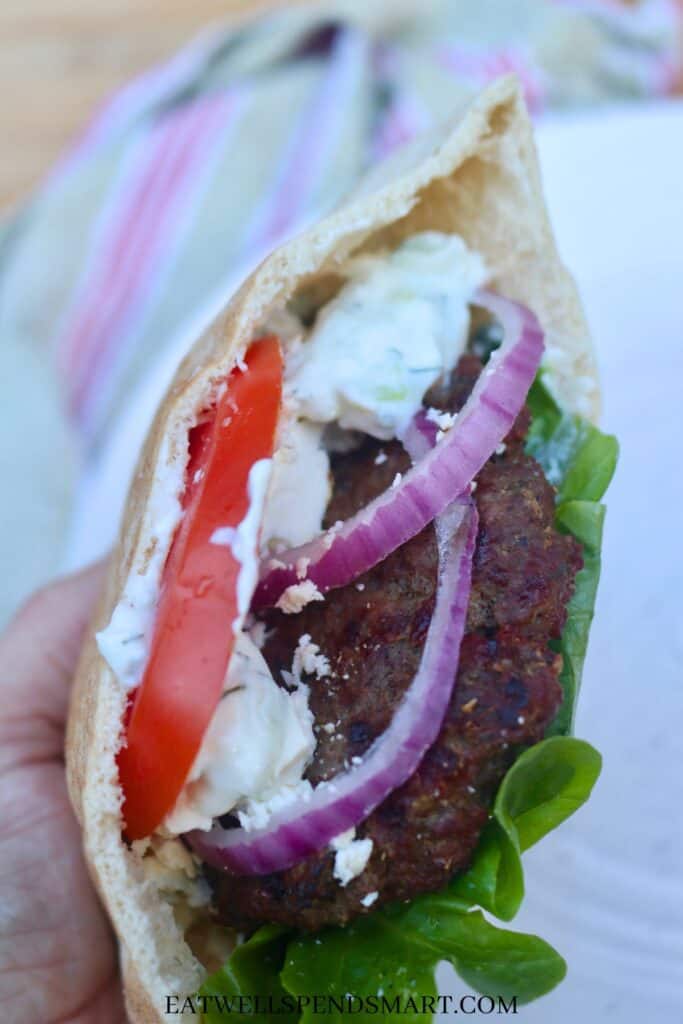 Close up of an gyro burger in a pita. 